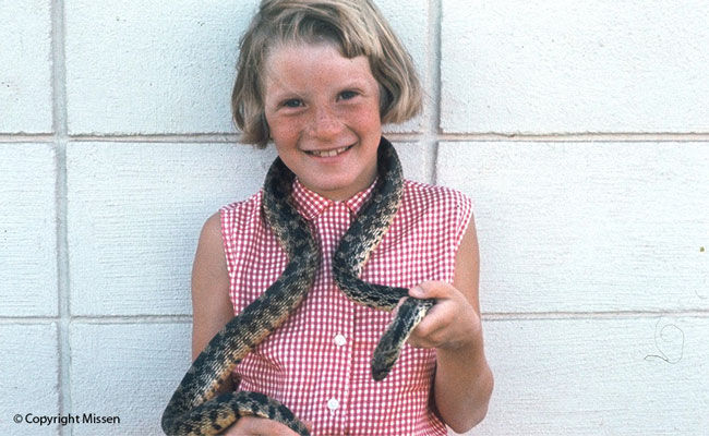 Kathryn bravely befriends an inhabitant of Reptile Gardens, Rapid City, South Dakota, July 1968