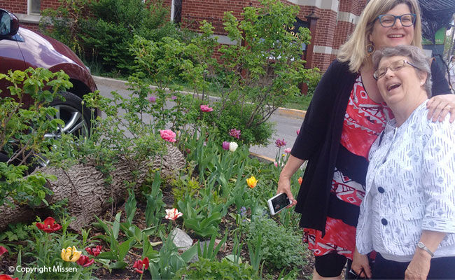 Nancy and Lynne admire the gardens that Kathryn used to tend at St. Barnabas Apostle and Martyr Anglican Church, Ottawa, 2016