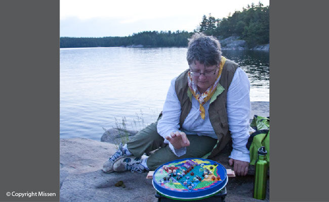 Kathryn plays Chinese checkers at Schooner Lake